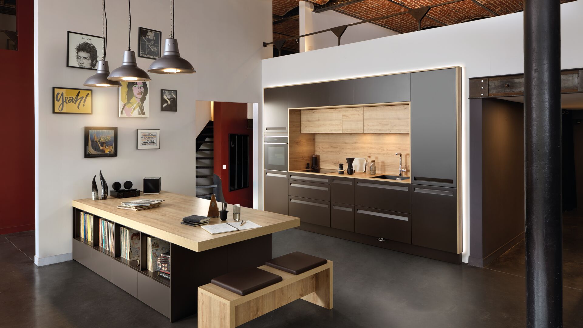 Built-in grey kitchen with a wooden island table
