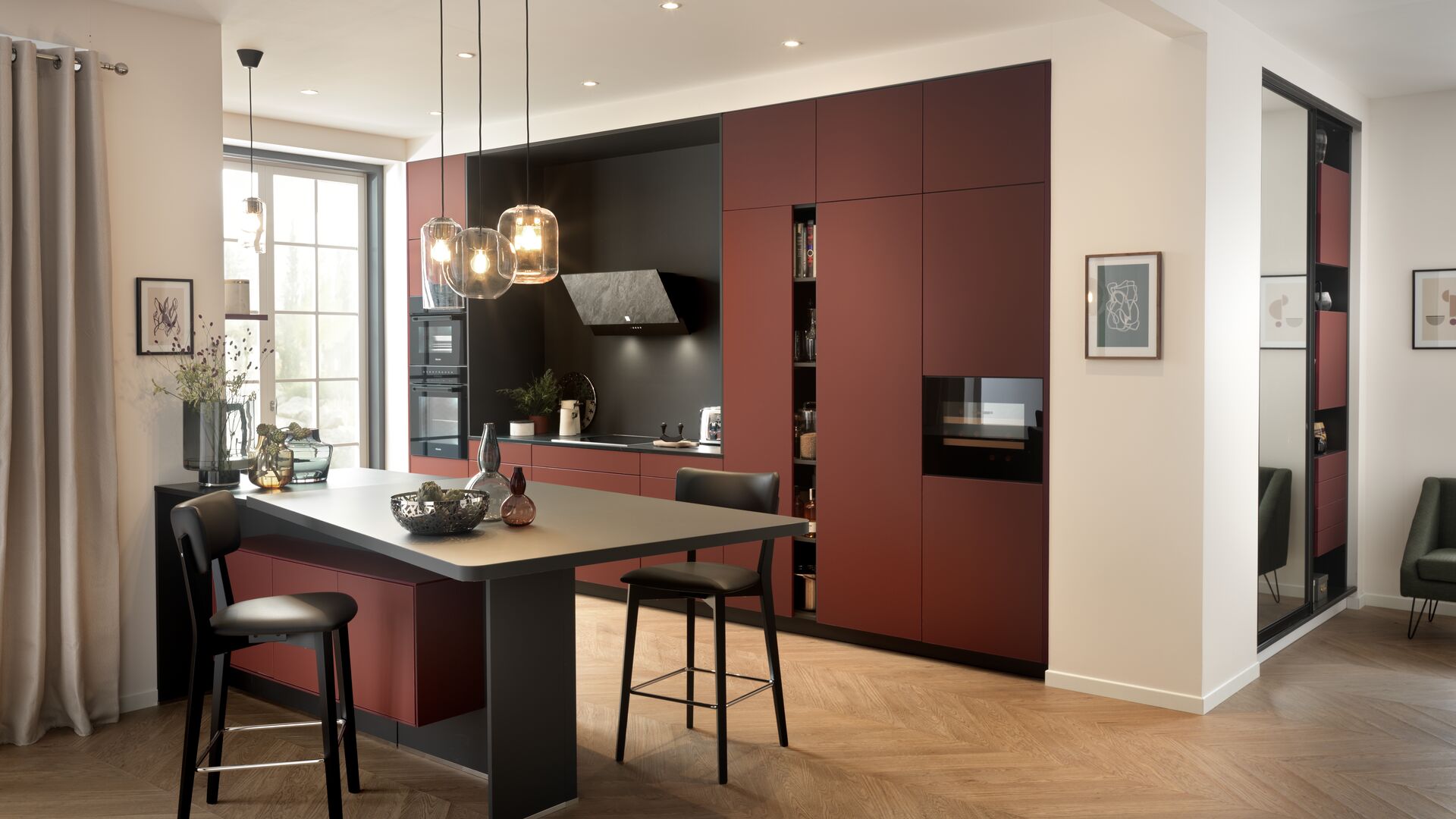 Full-length red and black built-in kitchen with central island
