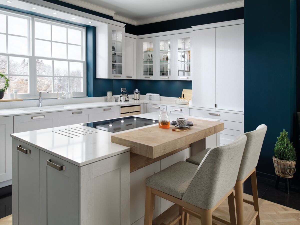 Rustic white kitchen with island and blue wall