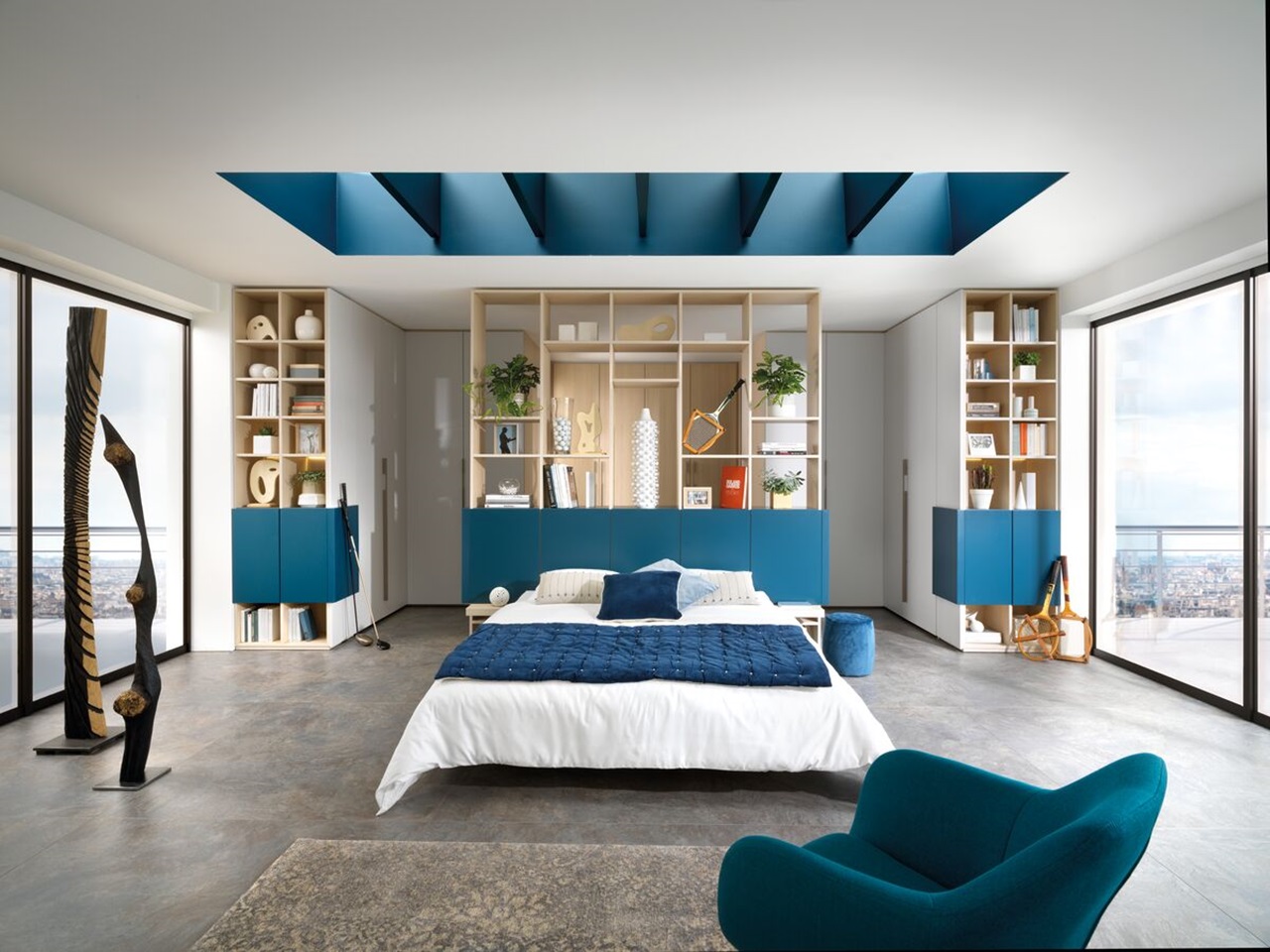 Vue de biais du lit, des bibliothèques et des dressing de l'ambiance de la chambre Arcos melaminé, coloris bois Magnus et blanc Celest.