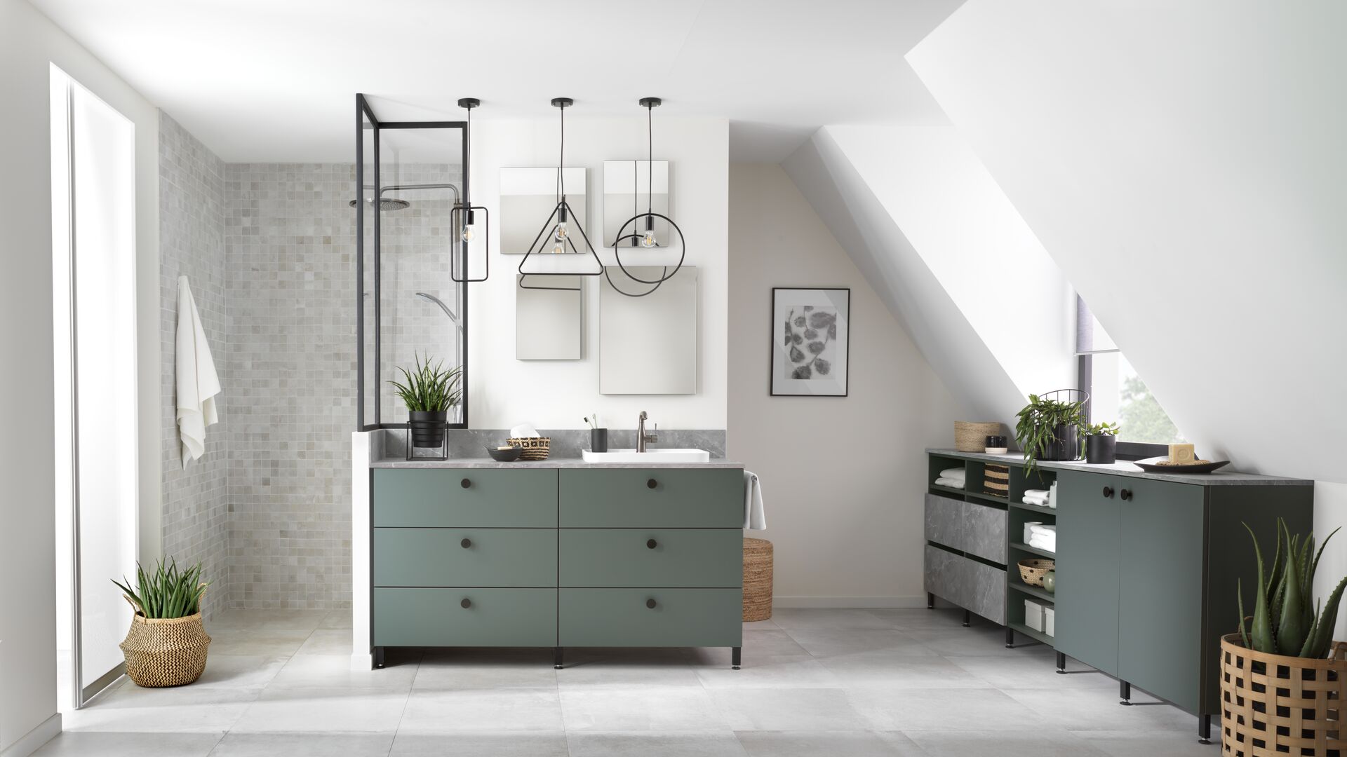 Bathroom under sloping ceiling with grey-green units and walk-in shower