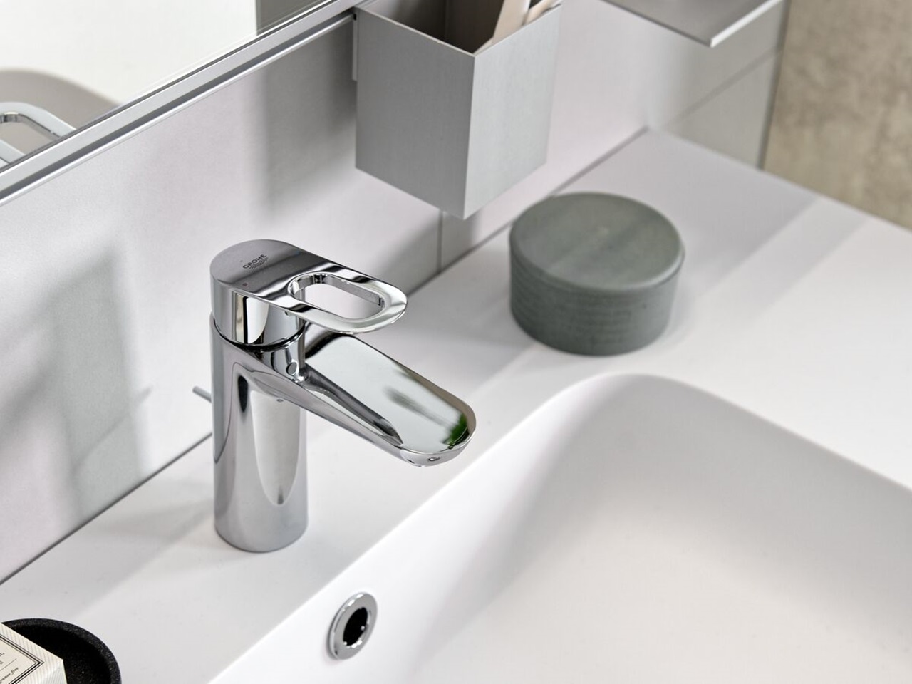 Matt white bathroom counter top with built-in basin and chrome mixer tap